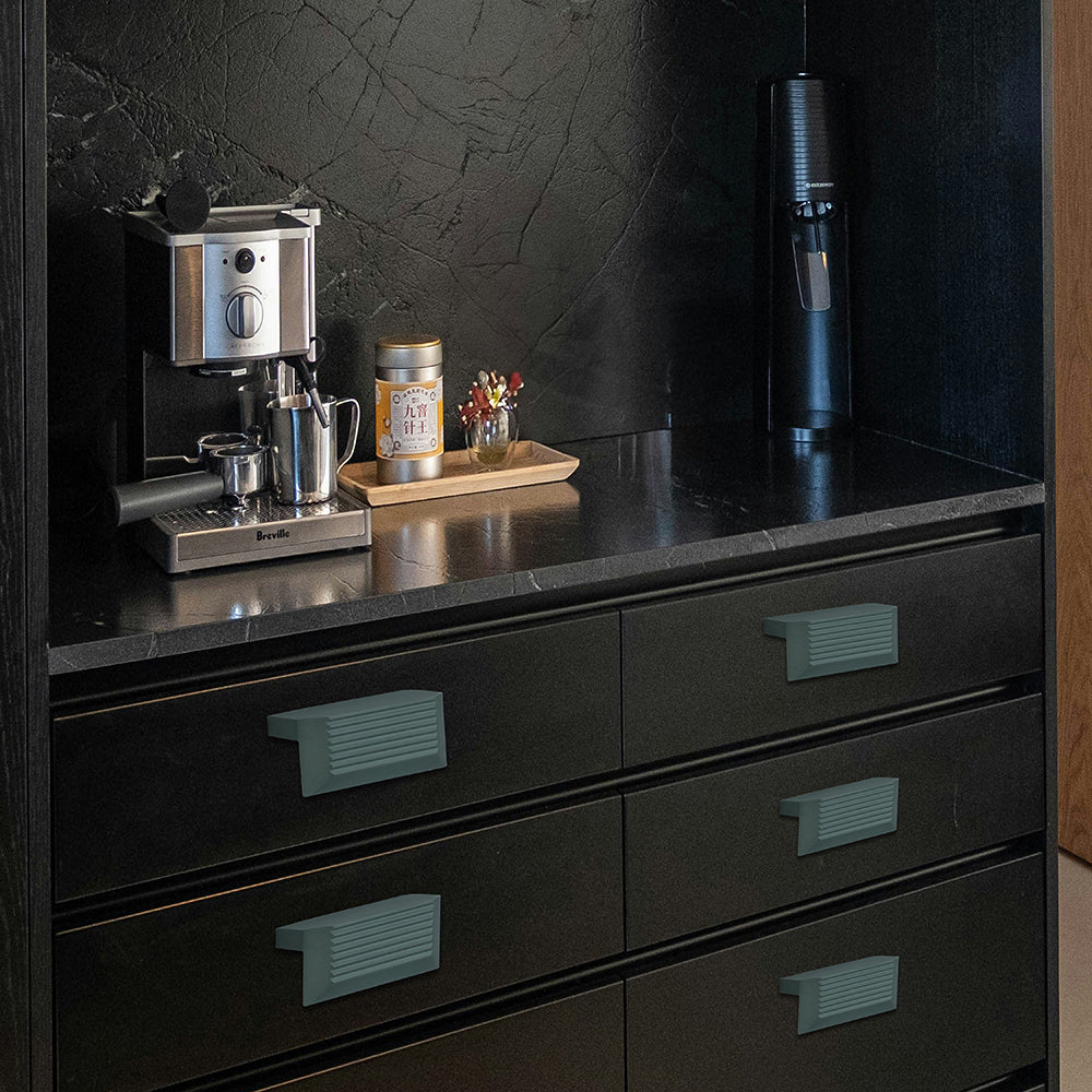 Pista green aluminium drawer knob 415 on dark kitchen cabinets — modern designer hardware