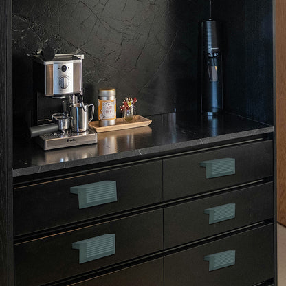 Pista green aluminium drawer knob 415 on dark kitchen cabinets — modern designer hardware